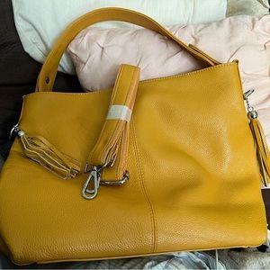 Mustard color  hand bag   Never used bought brand new. Has all tags